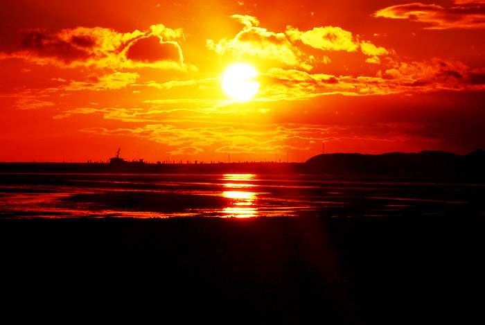 Untergehende Sonne &uuml;ber dem Westanleger